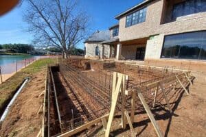 Steel rebar framework supporting in-ground pool structure